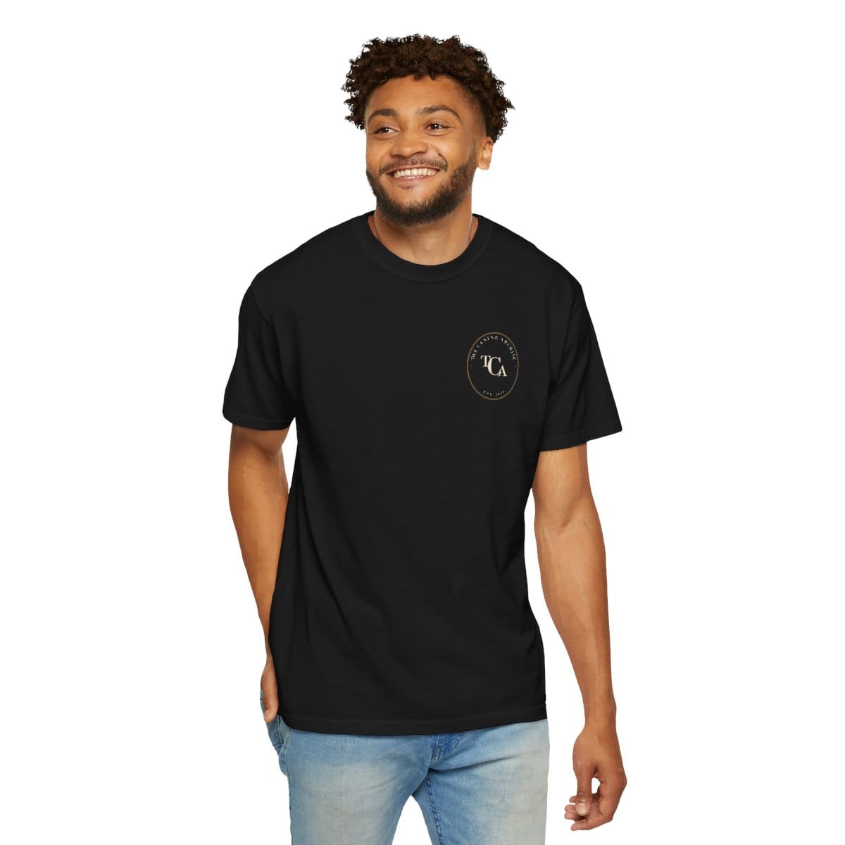 Model wearing the black Archive Crest Tee with a small chest crest